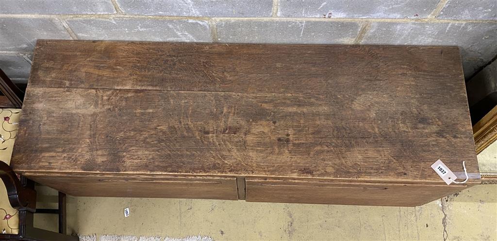 A Betty Joel style oak two door low cabinet, length 137cm, depth 44cm, height 55cm
